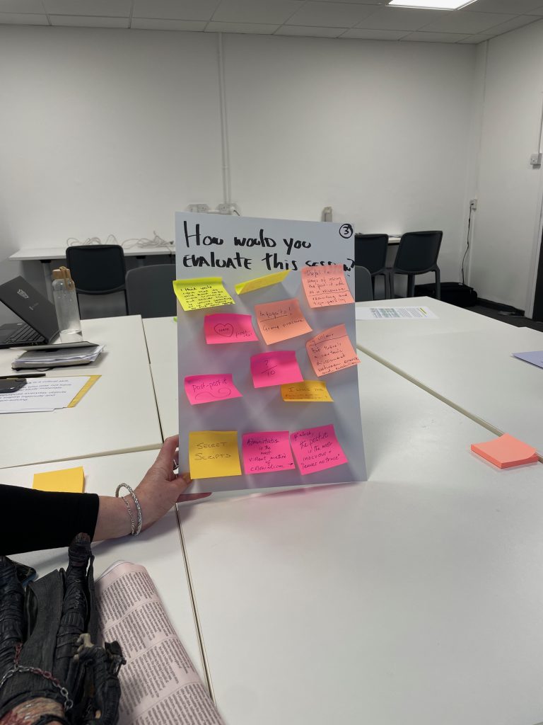 Hand stretched holding a board that says "How would you evaluate this session?" filled with post-its in yellow and pink colours
